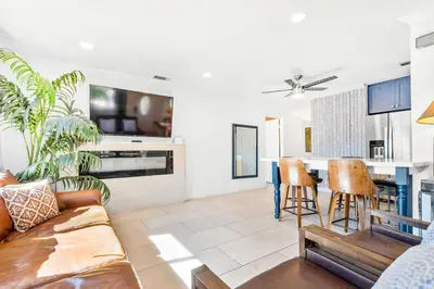 a living room with a couch and a table at Gated 6beds 2garage home near Disney other LA attraction in Chino