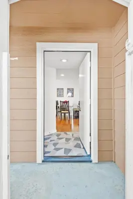 an open door into a house with a checkered floor at 5bed 3bath Private gated community home 7miles to Downtown La close to Disney in Commerce