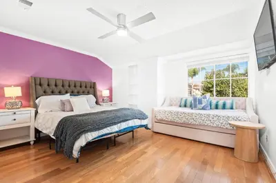 a bedroom with two beds and a window at 5bed 3bath Private gated community home 7miles to Downtown La close to Disney in Commerce