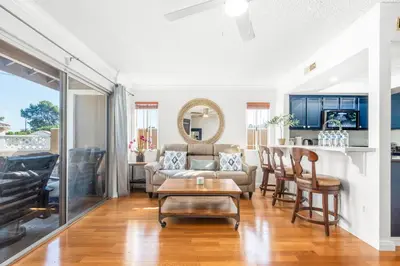 a living room with a couch and a table at 5bed 3bath Private gated community home 7miles to Downtown La close to Disney in Commerce