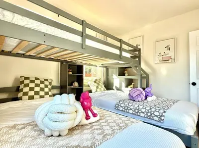a bedroom with two beds with stuffed animals on them at Jies choice- Modern Luxe in Altadena in Altadena