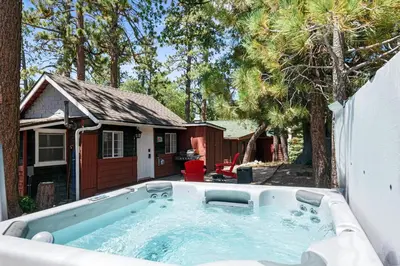 a hot tub in the backyard of a house at Little Lux - Hot Tub, Walk to Village & Lake in Big Bear Lake
