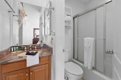 a bathroom with a toilet and a sink and a shower at Lakeview Condo - Lakefront Complex, Lake Views, Heated Pool in Big Bear Lake