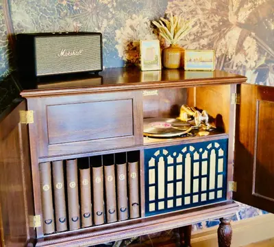 a wooden book shelf with a plate on it at Villa Encanto- LUXE Spanish Villa with 6 KING Bedrooms, Courtyard and New Game Room in Long Beach