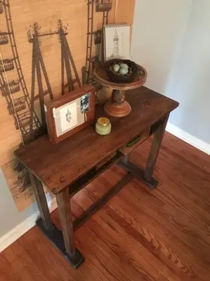 a wooden table with a picture on top of it at Beautifully Restored Pasadena English Cottage in Pasadena