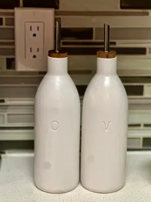 two white bottles sitting on top of a counter at Cozy Gem Near Old Town Pasadena in Pasadena
