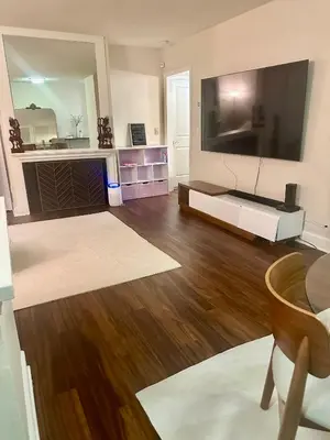 a living room with a large flat screen tv at Cozy Gem Near Old Town Pasadena in Pasadena
