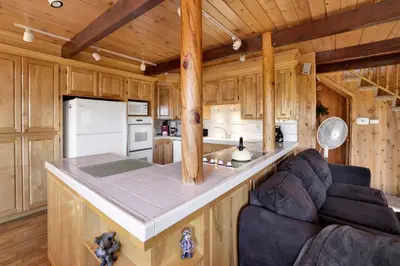 a kitchen with a large island in a cabin at Mountain Hideaway on Maryland #2494 in Big Bear Lake