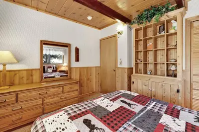 a bedroom with a bed and a dresser at Mountain Hideaway on Maryland #2494 in Big Bear Lake