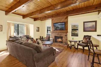 a living room with a couch and a fireplace at Buttercup #2508 in Big Bear Lake