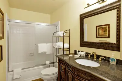 a bathroom with a sink and a toilet and a mirror at Buttercup #2508 in Big Bear Lake