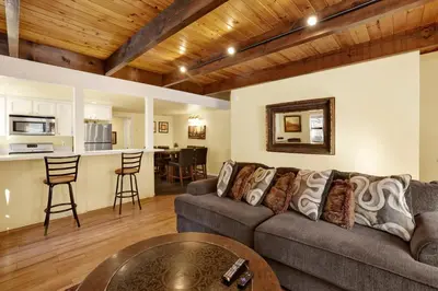 a living room with a couch and a table at Buttercup #2508 in Big Bear Lake