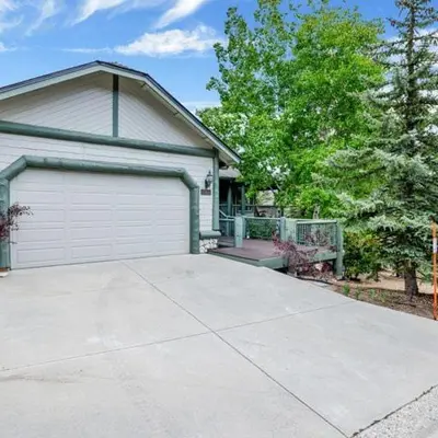 a house with a garage and a driveway at Castle Glen Gem #2220 in Big Bear Lake