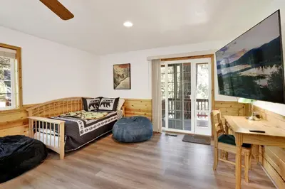 a living room with a couch and a table at Lookout Lodge #2128 in Big Bear City
