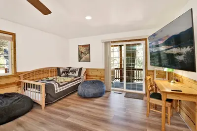a living room with a couch and a table at Lookout Lodge #2128 in Big Bear City