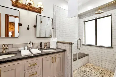 a bathroom with two sinks and a shower at Serenity Cove Lake House #2472 by Big Bear Vacations in Big Bear Lake