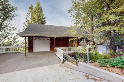a house with a porch and a garage at Cloud Nine in Lake Arrowhead
