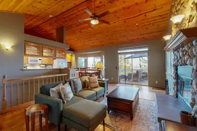 a living room with a couch and a table at Cloud Nine in Lake Arrowhead