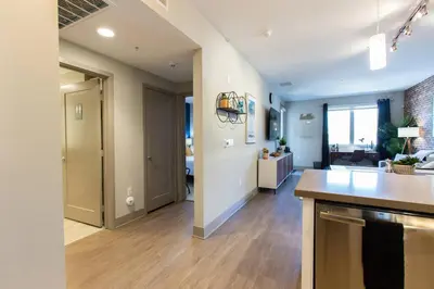 a room with a kitchen and a living room at 3 Miles to Disney Heated Pool CnvntnCtr Jacuzzi in Fullerton