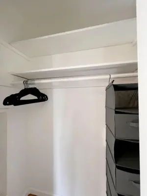 a room with a closet with aabinet and a shelf at The Culver Retreat Family Oasis w Office Backyard in Los Angeles