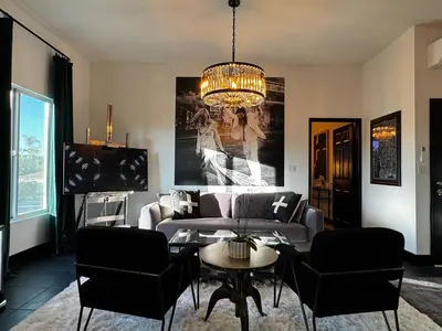 a living room with a couch and a table at The Loft at Butler in Los Angeles
