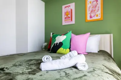 a pile of rolled up towels sitting on a bed at Cozy 2BD Retreat in MarinaDelRey!Free Parking&Pool in Los Angeles