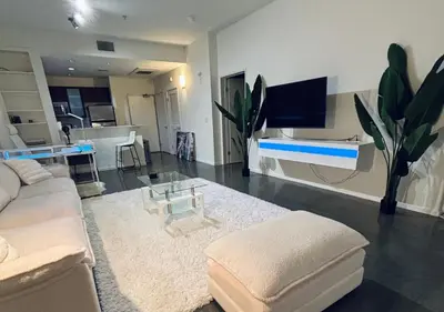 a living room with a couch and a tv at 1 br spacious in Hollywood in Los Angeles