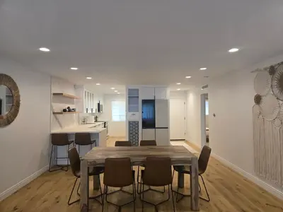 a dining room and kitchen with a table and chairs at NEW 2BD Majestic Gateway in Glendale in Glendale
