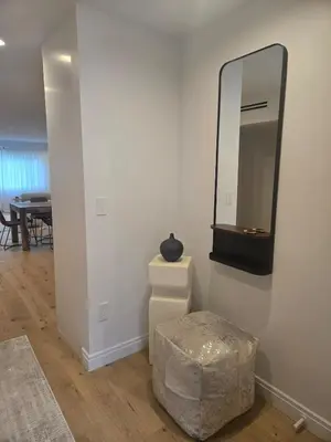 a room with a mirror and a stool and a table at NEW 2BD Majestic Gateway in Glendale in Glendale