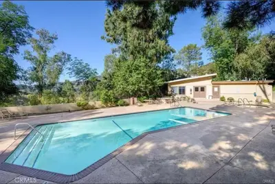 a swimming pool in front of a house at NEW 2BD Majestic Gateway in Glendale in Glendale