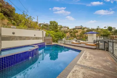a swimming pool in the backyard of a house at Franklin Mediterranean Villa in Los Angeles