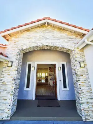 a building with an archway in front of a door at Huge Family House Vacation Villa VIEW Pool King Bedroom in Walnut
