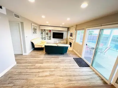 a large living room with a tub and a television at Huge Family House Vacation Villa VIEW Pool King Bedroom in Walnut
