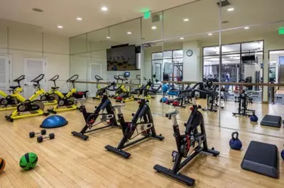 a gym with a lot of treadmills and exercise bikes at Cozy Large 1 Bedroom Condo by UCLA in Los Angeles