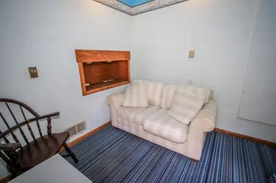 a living room with a couch and a chair at A Big Olympic Getaway in Big Bear Lake
