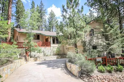 a house with a driveway in front of it at A Big Olympic Getaway in Big Bear Lake