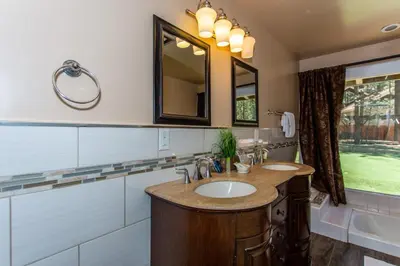 a bathroom with a sink and a mirror at Big Bear Splash in Big Bear Lake