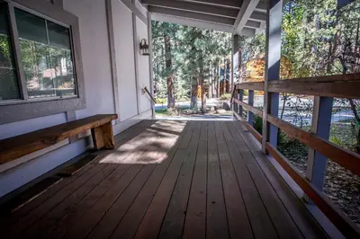 a porch of a house with a wooden deck at Majestic Pines in Big Bear Lake