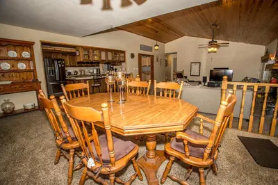 a dining room with a wooden table and chairs at Majestic Pines in Big Bear Lake