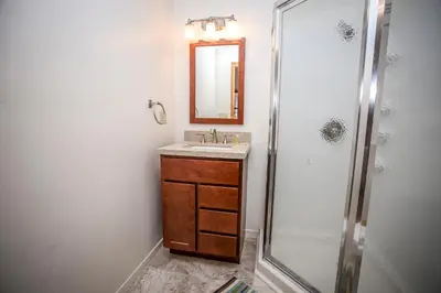 a bathroom with a sink and a shower at Mountain Air in Big Bear Lake