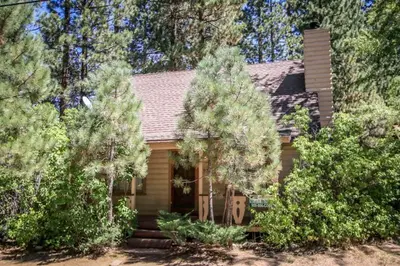 a small house with trees in front of it at Mountain Air in Big Bear Lake