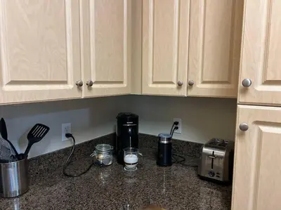 a kitchen counter with a coffee maker and a toaster at Spacious 1bdrm apartment 10 mins to Cedars-Sinai by car FREE Parking, King bed in Los Angeles