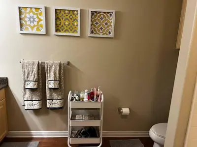a bathroom with a shelf with cosmetics and towels at Spacious 1bdrm apartment 10 mins to Cedars-Sinai by car FREE Parking, King bed in Los Angeles