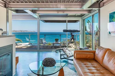 a living room with a view of the ocean at Beachfront Villa Broad Beach Direct Beach Access in Malibu