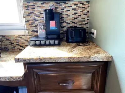 a coffee maker sitting on top of a counter at Hilltop Oasis Near Palos Verdes in San Pedro