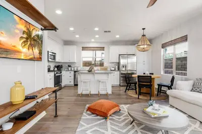 a living room with a couch and a table at GOODE HOMES Luxury Villa with Community Pool and Spa in Santa Clarita