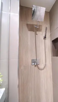 a shower with a shower head in a bathroom at Modern LA Home - King Bed, Outdoor Living, Firepit in Los Angeles
