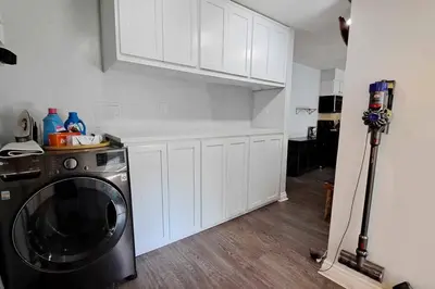 a kitchen with a washing machine in a room at 2bdr Bluff Heights Condo walking distance to beach in Long Beach