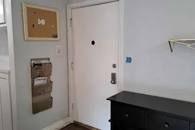 a room with a white door and a black cabinet at 2bdr Bluff Heights Condo walking distance to beach in Long Beach