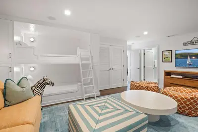 a living room with a bed with a zebra on the wall at The Getaway Oceanfront Villa in Malibu by Stay Awhile in Malibu